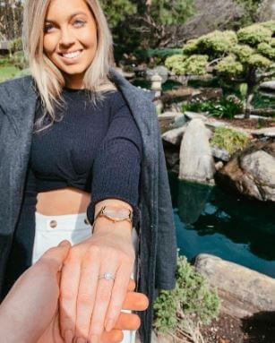 A moment right after Katelyn Timmings accepted the proposal of Craig Goodwin.